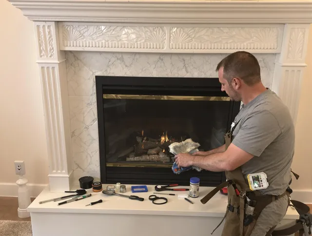 Holliston Chimney Sweep performing fireplace maintenance in Holliston, MA